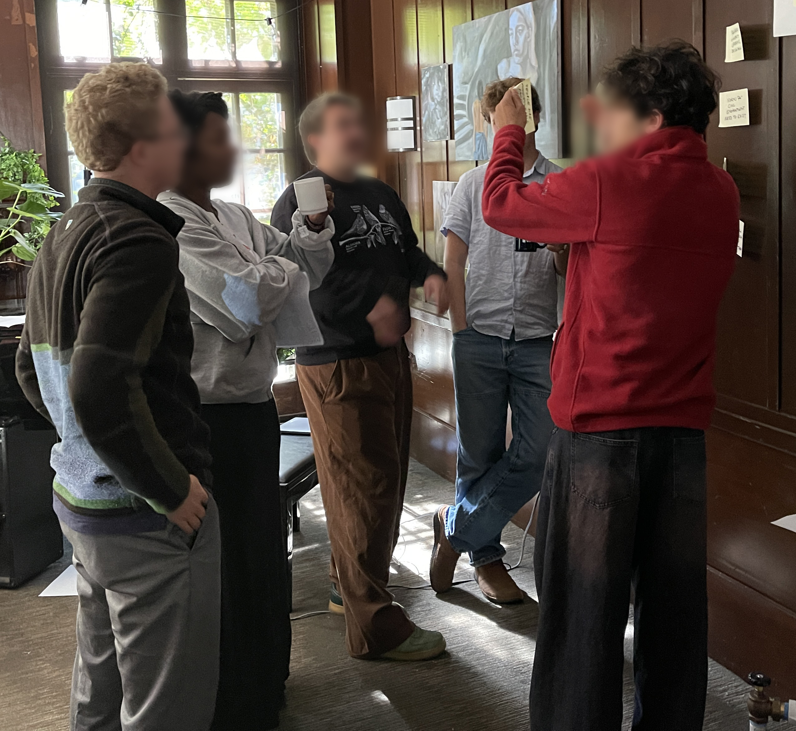 Group of students discussing EDU's long term vision and mission